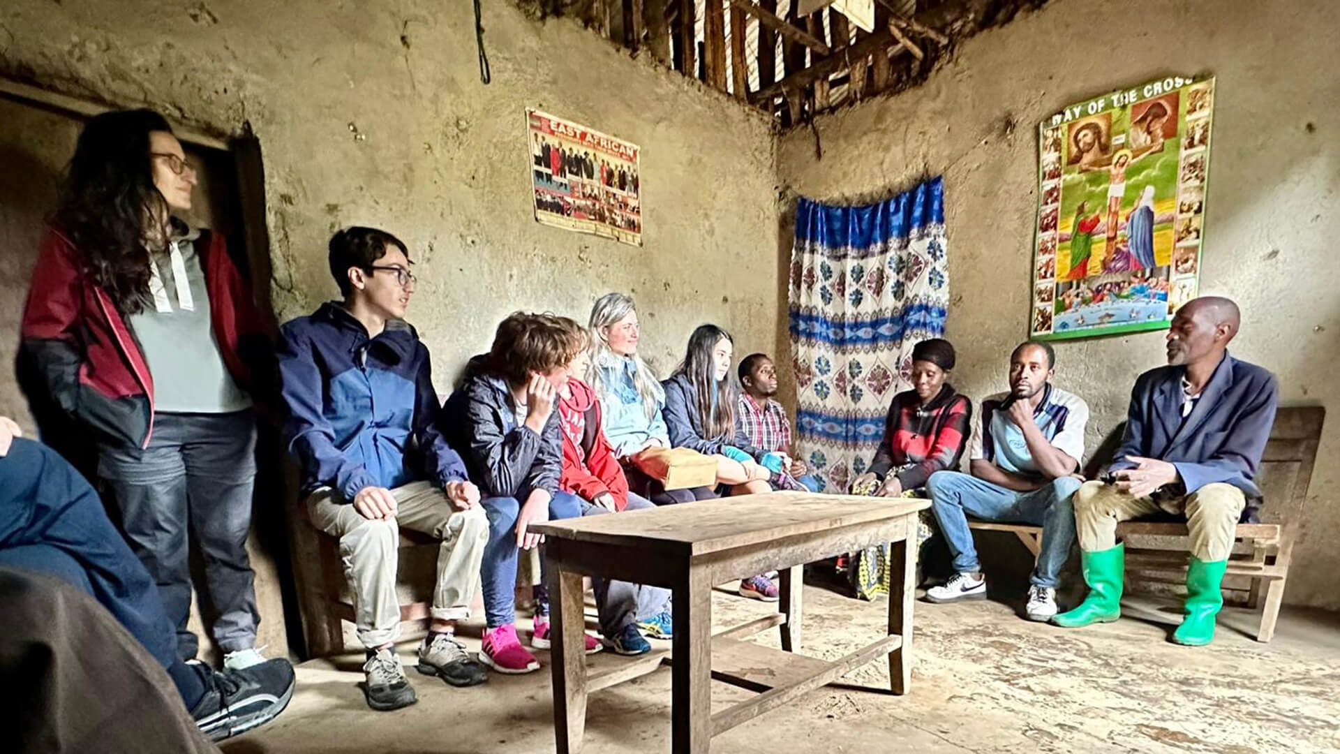 learners-and-families-visting-a-rwandan-family-home